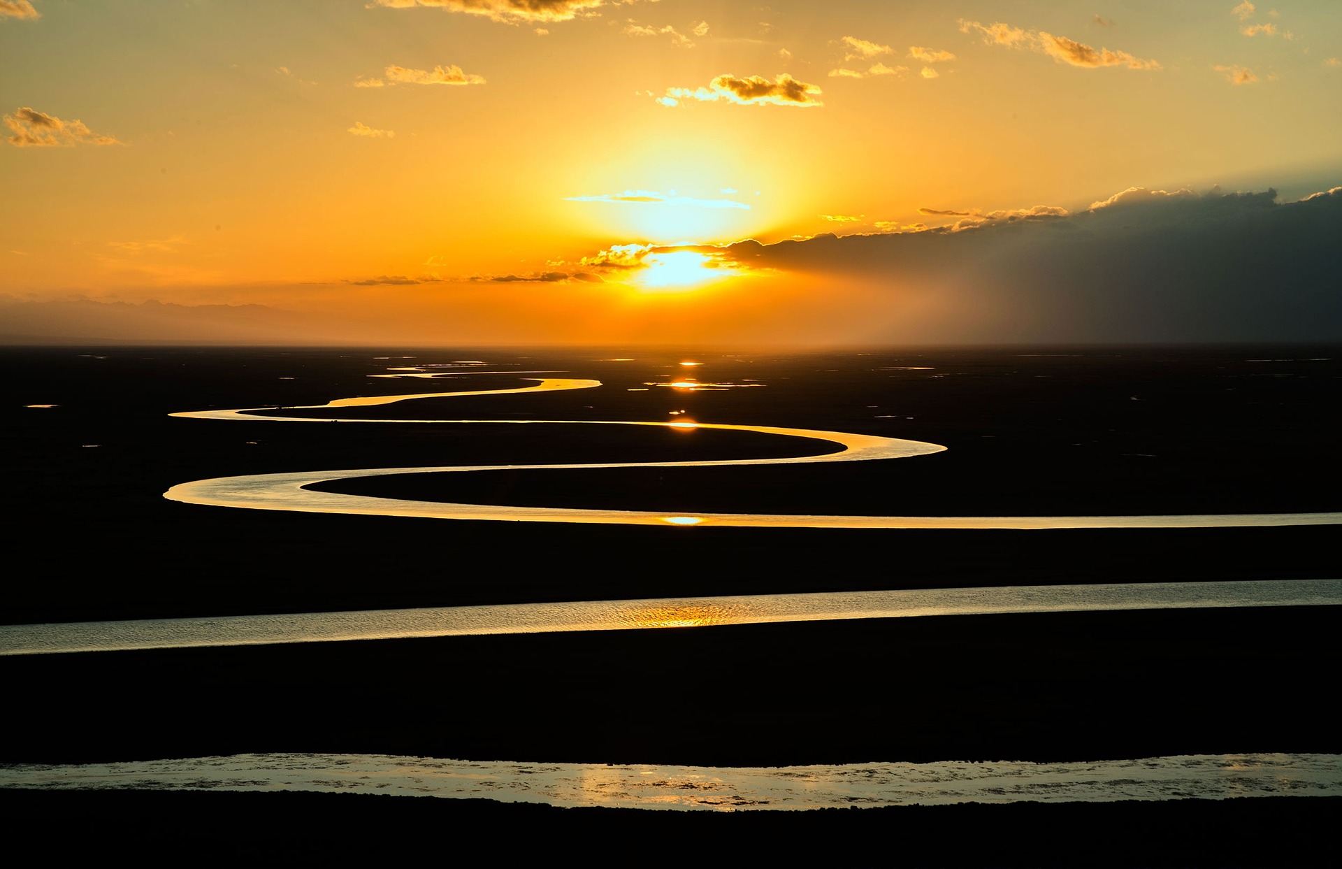 services Meandering river and sunset